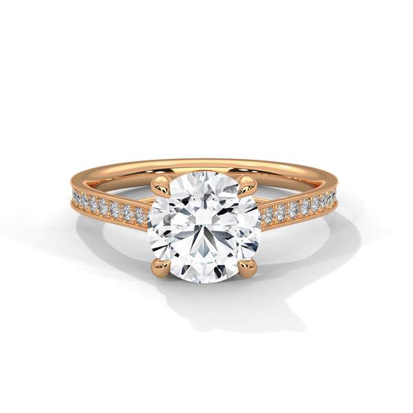 “Aurora Ring—round brilliant diamond sparkle, sleek pavé-band elegance, and timeless white-gold beauty crafted to symbolize radiant love, grace, and unforgettable moments.”