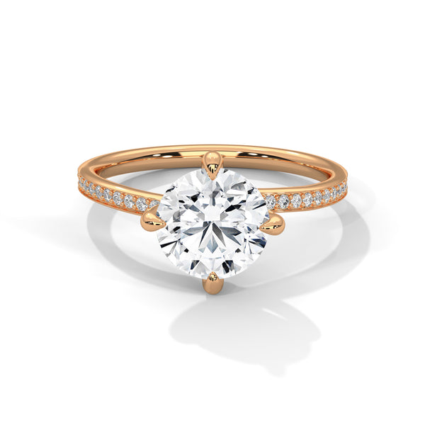 “Celeste Ring—round brilliant diamond beauty, four-prong tulip elegance, and refined pavé sparkle crafted to symbolize timeless love, radiant grace, and everlasting sophistication.”