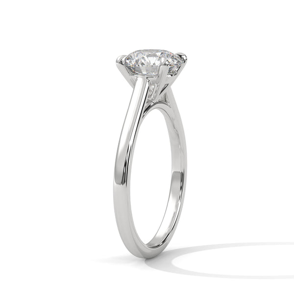 “Celeste Ring—round brilliant diamond sparkle, minimalist four-prong solitaire elegance, and timeless white-gold beauty crafted to symbolize pure love and lasting sophistication.”