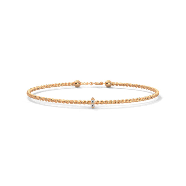 Lunara Glow is a 7-inch diamond bangle bracelet featuring 5 carats of round-cut brilliance, offering timeless elegance in a sleek, sculptural silhouette.