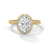 A graceful oval-cut lab-grown diamond encircled by a shimmering halo — effortless elegance with eye-catching brilliance