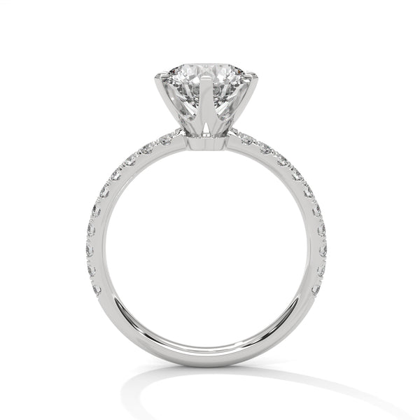 “Celestia Ring—round-cut diamond brilliance, secure six-prong elegance, and pavé-band sparkle crafted to symbolize timeless beauty, lasting love, and radiant sophistication.”