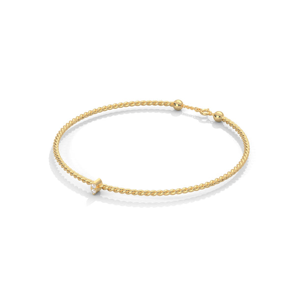 Lunara Glow is a 7-inch diamond bangle bracelet featuring 5 carats of round-cut brilliance, offering timeless elegance in a sleek, sculptural silhouette.