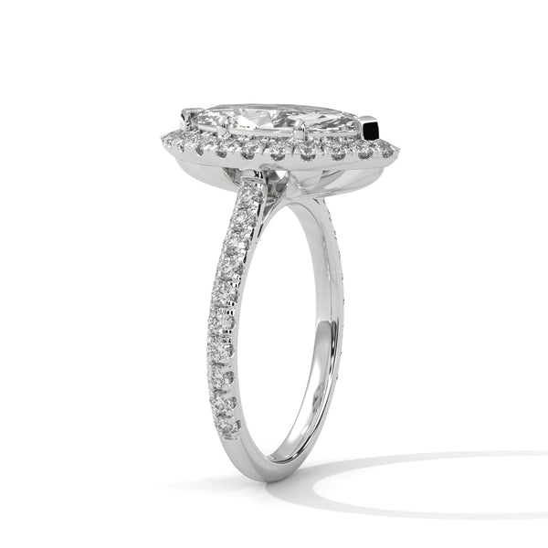 “Celestia Ring—marquise diamond brilliance, radiant halo sparkle, and pavé white-gold elegance crafted to symbolize timeless love, luxury, and unforgettable moments.”