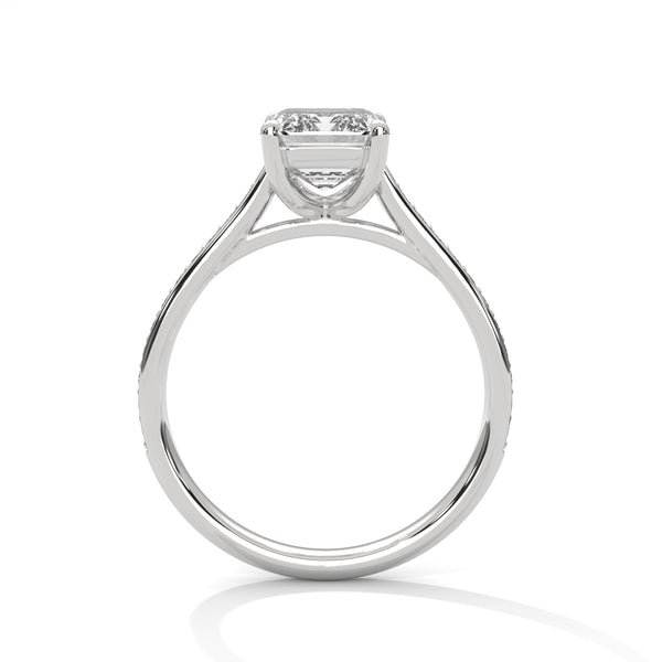 The Celestial Elegance Ring features a striking emerald-cut diamond embraced by a delicate band adorned with shimmering pave stones. A timeless piece that symbolizes everlasting love and sophistication.