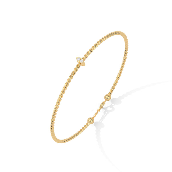 Lunara Glow is a 7-inch diamond bangle bracelet featuring 5 carats of round-cut brilliance, offering timeless elegance in a sleek, sculptural silhouette.