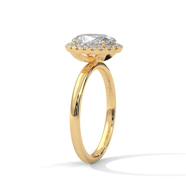 A graceful oval-cut lab-grown diamond encircled by a shimmering halo — effortless elegance with eye-catching brilliance