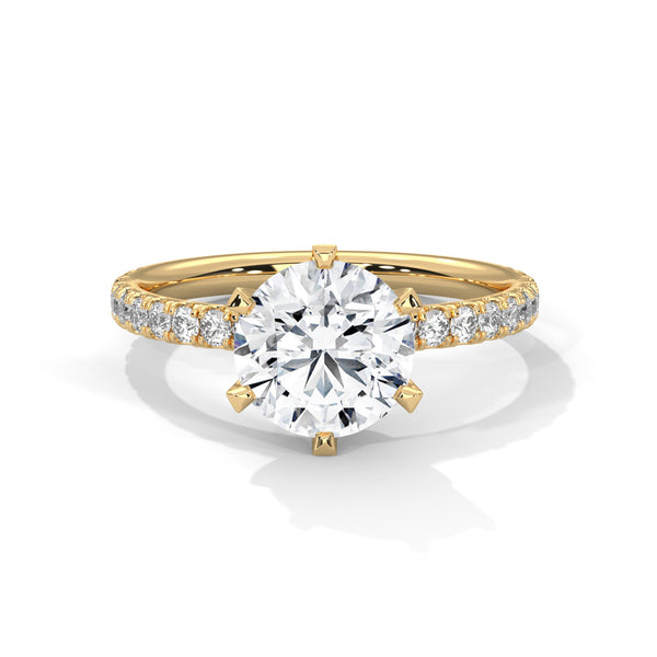 “Celestia Ring—round-cut diamond brilliance, secure six-prong elegance, and pavé-band sparkle crafted to symbolize timeless beauty, lasting love, and radiant sophistication.”