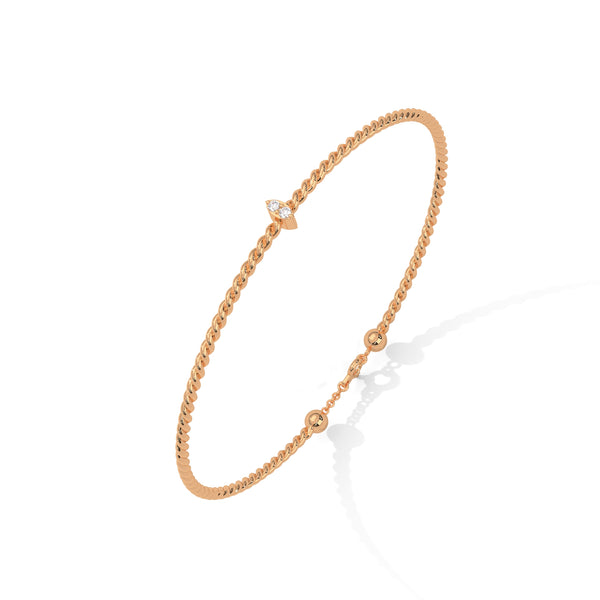 Lunara Glow is a 7-inch diamond bangle bracelet featuring 5 carats of round-cut brilliance, offering timeless elegance in a sleek, sculptural silhouette.