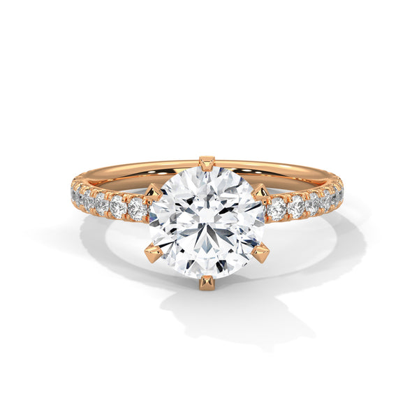 “Celestia Ring—round-cut diamond brilliance, secure six-prong elegance, and pavé-band sparkle crafted to symbolize timeless beauty, lasting love, and radiant sophistication.”