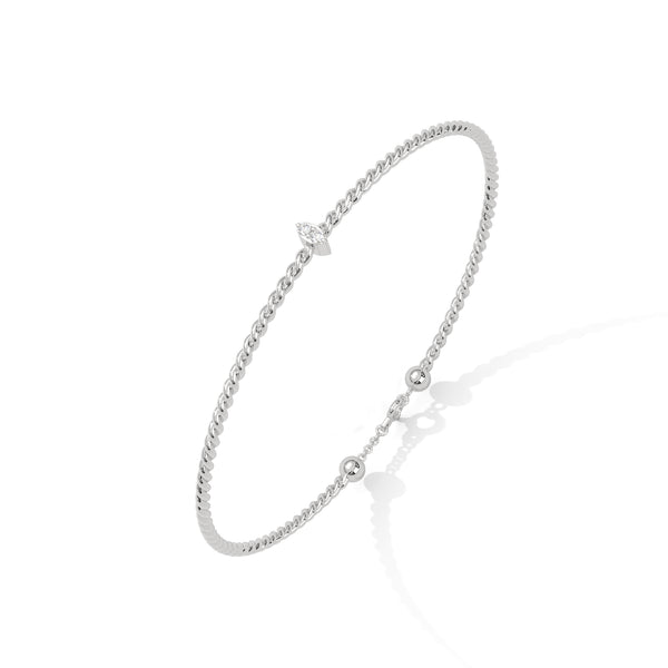 Lunara Glow is a 7-inch diamond bangle bracelet featuring 5 carats of round-cut brilliance, offering timeless elegance in a sleek, sculptural silhouette.
