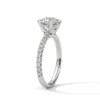 “Celestia Ring—round-cut diamond brilliance, secure six-prong elegance, and pavé-band sparkle crafted to symbolize timeless beauty, lasting love, and radiant sophistication.”