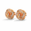 Delicate floral design meets sparkling elegance in these captivating gold diamond studs.