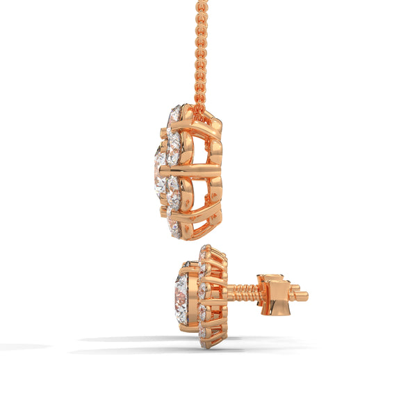 A captivating rose gold pendant and stud earring set featuring dazzling round-cut diamonds arranged in a blooming floral cluster for maximum sparkle and charm.