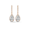 Dramatic rose gold danglers with pear-shaped centerpieces and a cascade of diamonds for breathtaking brilliance.