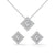 A striking rose gold jewelry set featuring square princess-cut diamonds framed in radiant round halos, combining sharp sophistication with brilliant sparkle.