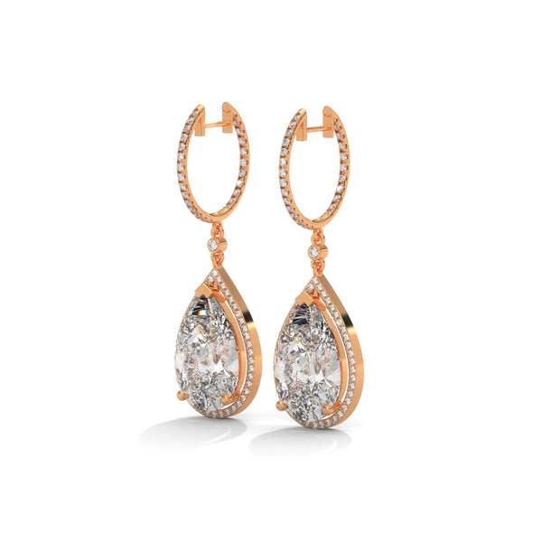 Dramatic rose gold danglers with pear-shaped centerpieces and a cascade of diamonds for breathtaking brilliance.