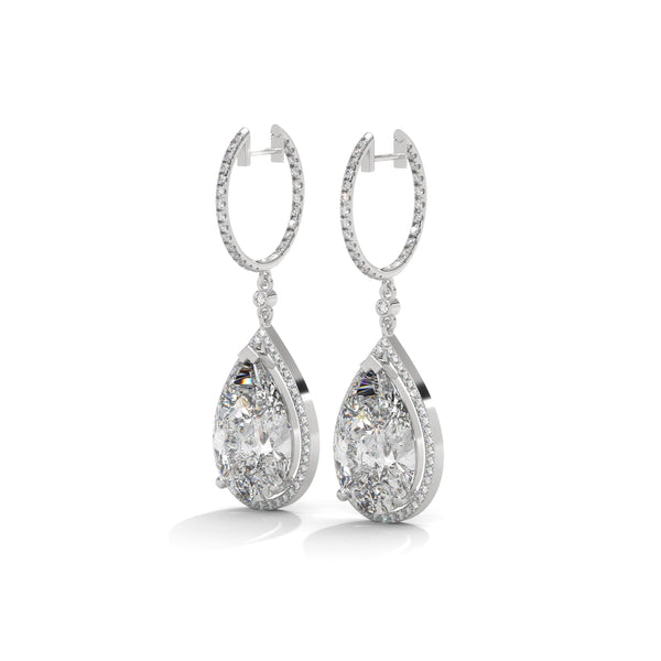 Dramatic rose gold danglers with pear-shaped centerpieces and a cascade of diamonds for breathtaking brilliance.