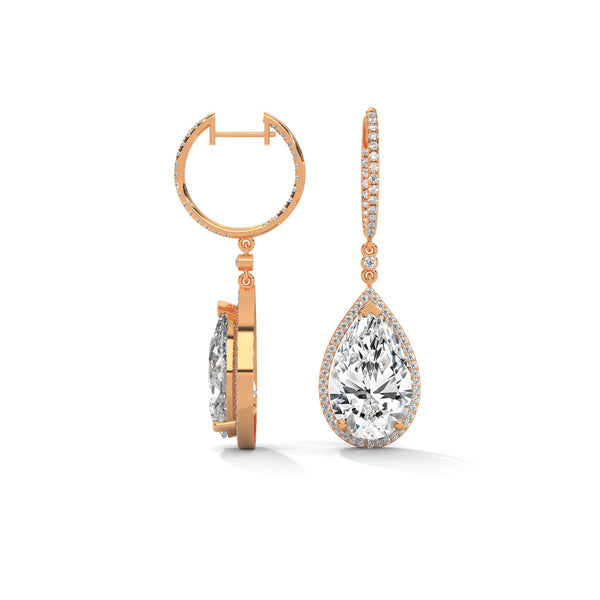 Dramatic rose gold danglers with pear-shaped centerpieces and a cascade of diamonds for breathtaking brilliance.