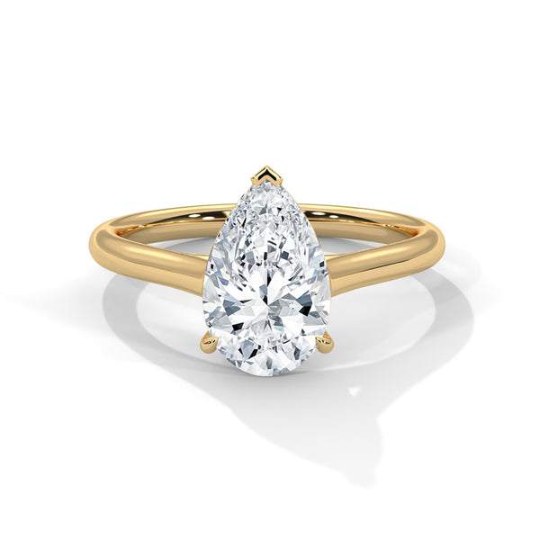“Discover timeless elegance with our pear-shapeddiamond solitaire ring—crafted in yellow gold for brilliant sparkle, modern luxury, and everlasting love.”