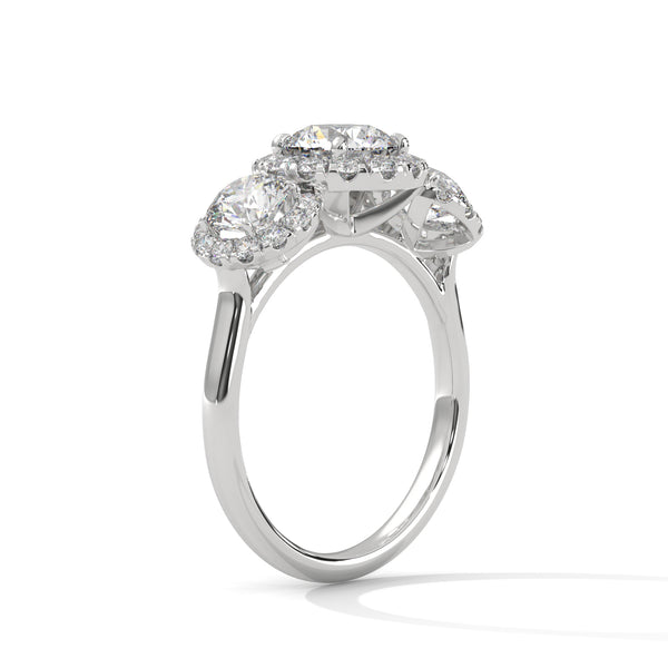 “Celebrate everlasting love with a three-stonehalo diamond ring that shines with brilliant sparkle, luxury craftsmanship, and timeless elegance.”