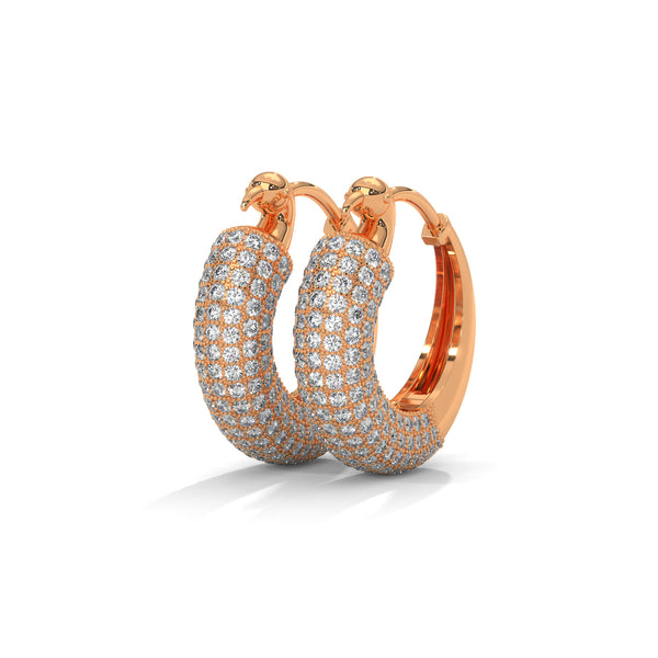 Bold gold hoop earrings encrusted with brilliant pavé diamonds and crowned with fierce panther heads.