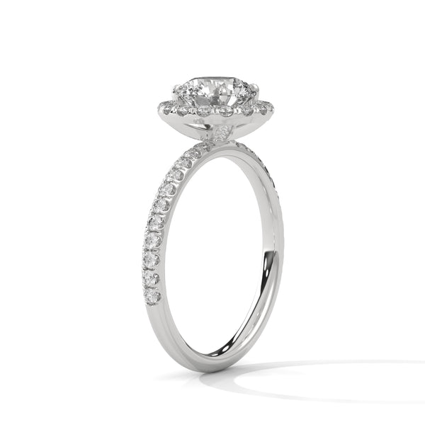 A brilliant round lab-grown diamond encircled by a halo of sparkle — timeless beauty with radiant allure.
