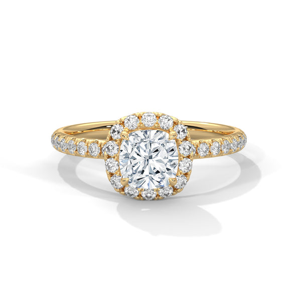 A cushion-cut lab-grown diamond surrounded by a delicate halo — timeless romance with a soft, feminine glow