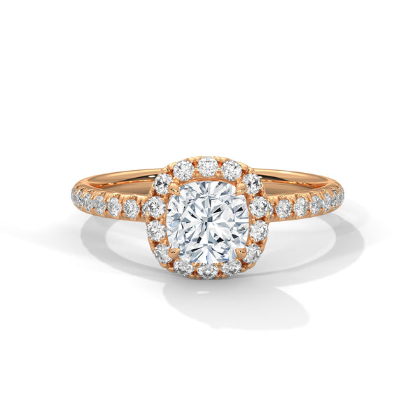 A cushion-cut lab-grown diamond surrounded by a delicate halo — timeless romance with a soft, feminine glow