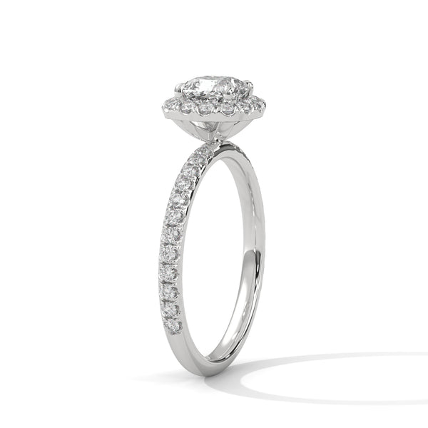 A cushion-cut lab-grown diamond surrounded by a delicate halo — timeless romance with a soft, feminine glow