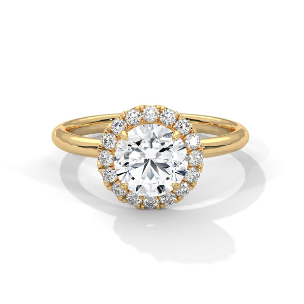 A classic round lab-grown diamond framed by a radiant halo — timeless brilliance with modern grace