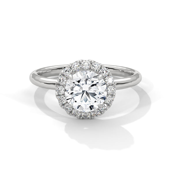 A classic round lab-grown diamond framed by a radiant halo — timeless brilliance with modern grace