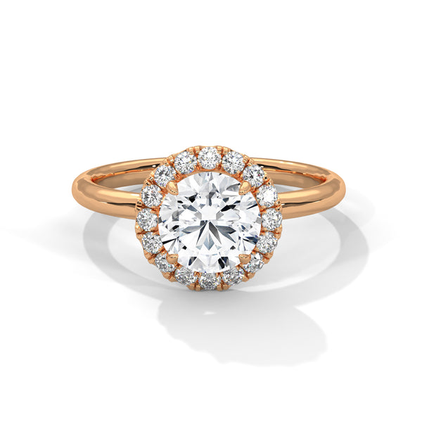 A classic round lab-grown diamond framed by a radiant halo — timeless brilliance with modern grace