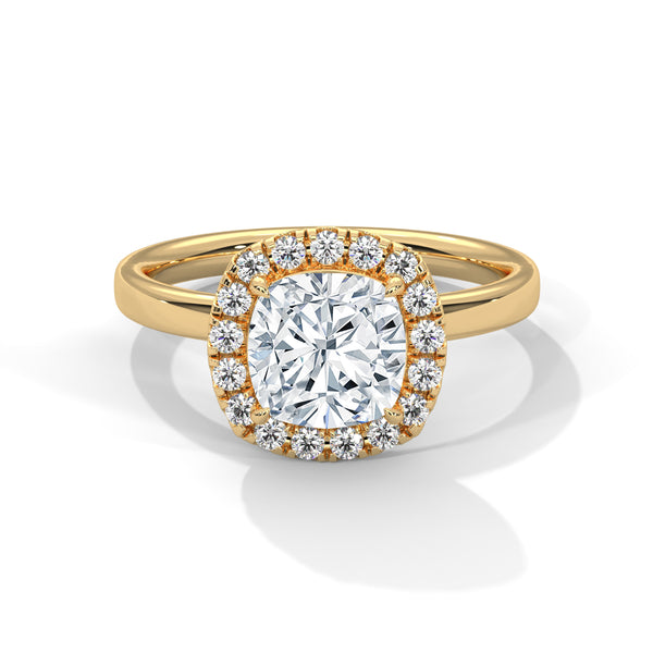 A soft cushion-shaped halo embraces a brilliant round lab-grown diamond — a romantic take on radiant sparkle.