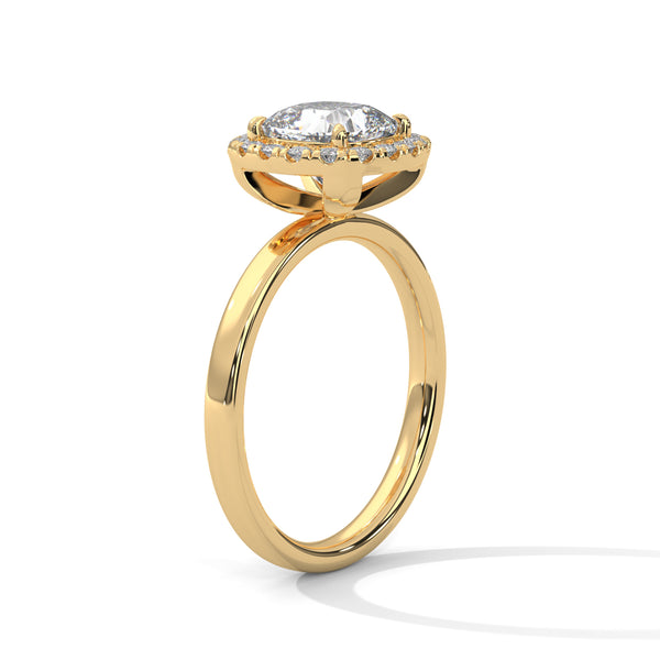 A soft cushion-shaped halo embraces a brilliant round lab-grown diamond — a romantic take on radiant sparkle.