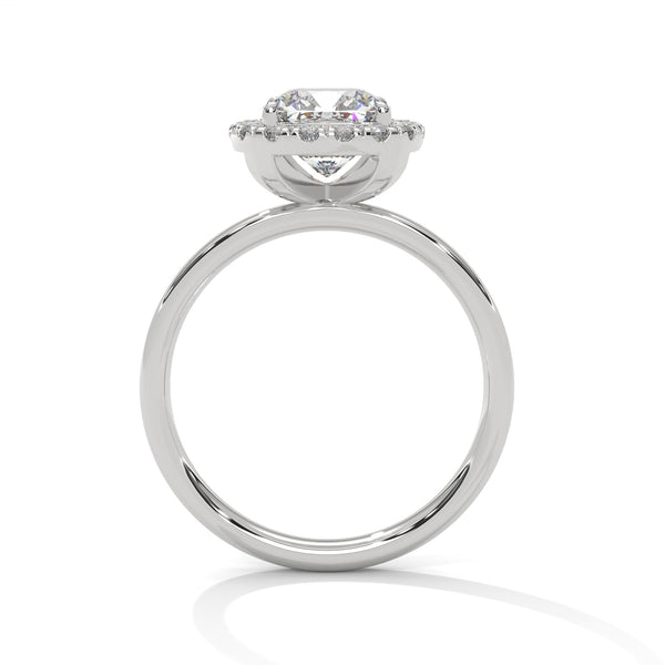 A soft cushion-shaped halo embraces a brilliant round lab-grown diamond — a romantic take on radiant sparkle.