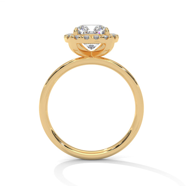 A soft cushion-shaped halo embraces a brilliant round lab-grown diamond — a romantic take on radiant sparkle.