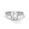 The Celestial Elegance Ring features a striking emerald-cut diamond embraced by a delicate band adorned with shimmering pave stones. A timeless piece that symbolizes everlasting love and sophistication.