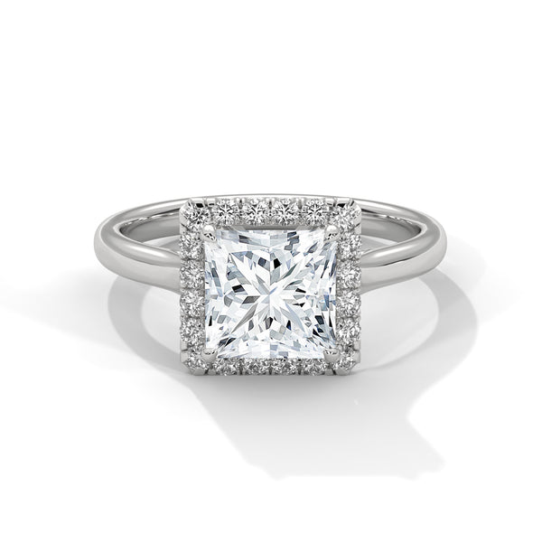 “Experience the Radiant Serenade Ring—princess-cut brilliance, halo sparkle, white-gold luxury, and timeless elegance crafted for unforgettable engagements and everlasting love.”