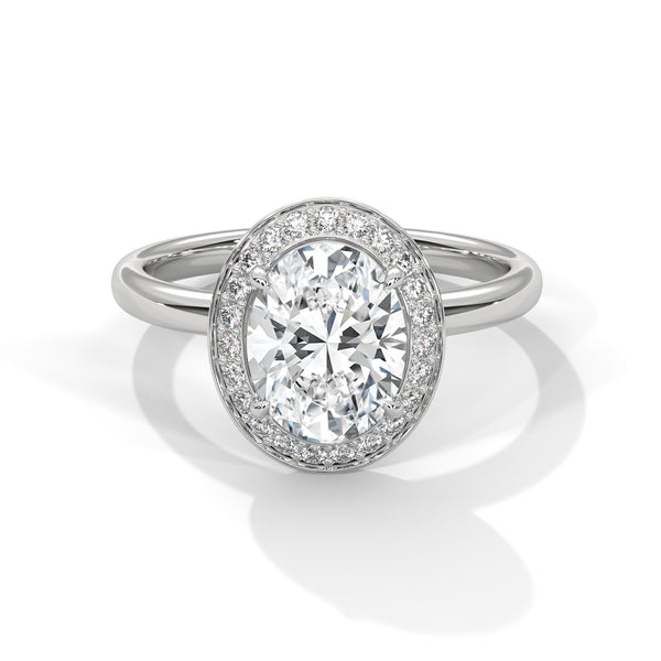 “Radiant Halo Ring—oval diamond brilliance, shimmering halo sparkle, and white-gold luxury crafted to symbolize timeless love, commitment, elegance, and unforgettable moments.”