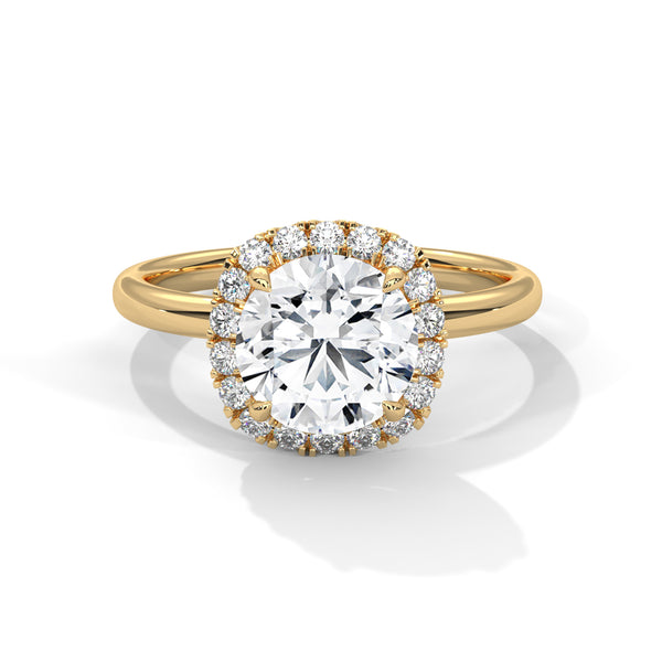“Aurielle Ring—round-diamond brilliance, cushion-halo elegance, and sleek white-gold luxury crafted to symbolize timeless love, modern charm, and unforgettable moments.”
