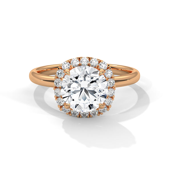 “Aurielle Ring—round-diamond brilliance, cushion-halo elegance, and sleek white-gold luxury crafted to symbolize timeless love, modern charm, and unforgettable moments.”