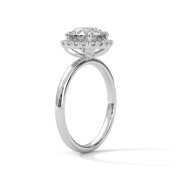“Aurielle Ring—round-diamond brilliance, cushion-halo elegance, and sleek white-gold luxury crafted to symbolize timeless love, modern charm, and unforgettable moments.”