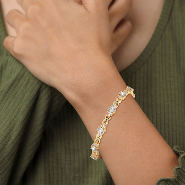 This exquisite tennis bracelet features 62 emerald-shaped diamonds, totaling 7.01 carats. With a 6.50-inch length, it is a stunning accessory that offers a perfect balance of brilliance and sophistication.