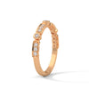 A whimsical yellow gold band featuring alternating bezel and pavé-set diamonds, creating a playful, elegant sparkle.