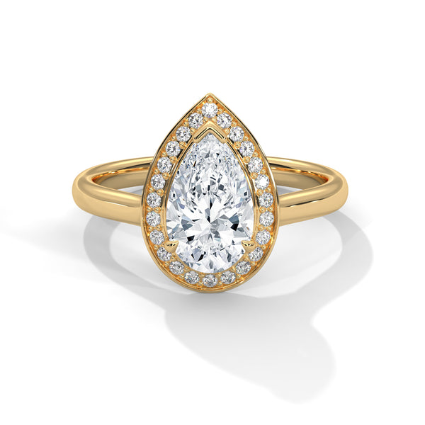 “Celeste Ring—pear-shaped diamond brilliance, radiant halo sparkle, and modern white-gold elegance crafted to symbolize celestial beauty, timeless love, and unforgettable moments.”
