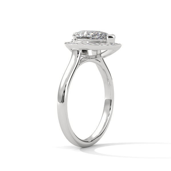 “Celeste Ring—pear-shaped diamond brilliance, radiant halo sparkle, and modern white-gold elegance crafted to symbolize celestial beauty, timeless love, and unforgettable moments.”