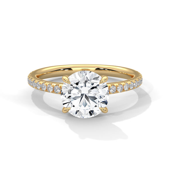 “Celeste Ring—round-cut diamond brilliance, delicate pavé sparkle, and classic white-gold elegance crafted to symbolize timeless beauty, modern romance, and unforgettable moments.”