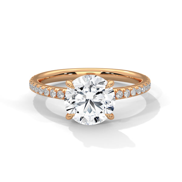 “Celeste Ring—round-cut diamond brilliance, delicate pavé sparkle, and classic white-gold elegance crafted to symbolize timeless beauty, modern romance, and unforgettable moments.”