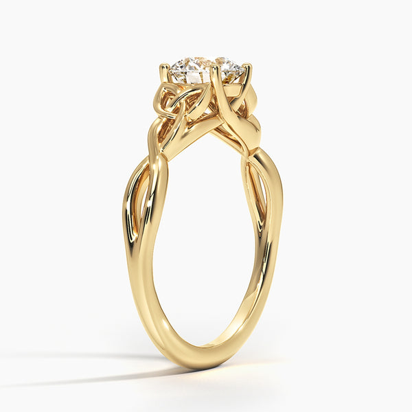 A round brilliant solitaire embraced by an intricate vine-inspired setting, intertwining elegance and organic artistry.